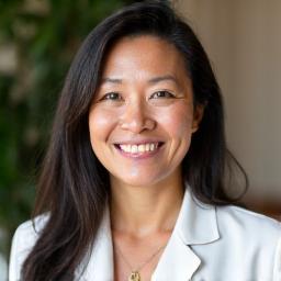 Dr. Elara Vance, smiling wellness coach and nutritionist.