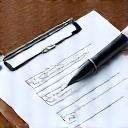 Clipboard with a checklist and a pen, indicating a thorough review and approval process.